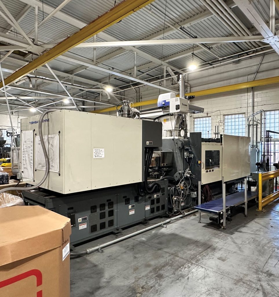 An injection molding machine at the Cooper Plastics manufacturing facility
