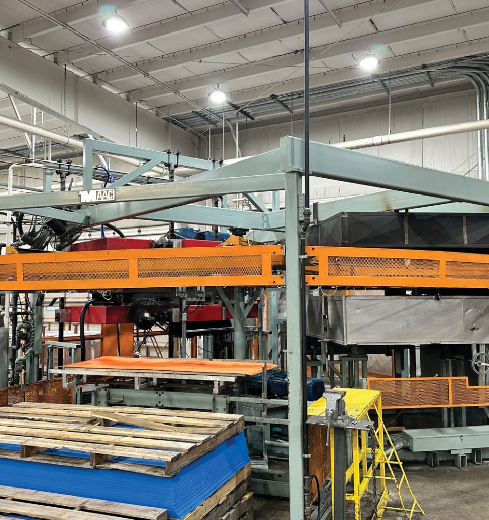 A vacuum forming machine at the Cooper Plastics manufacturing facility
