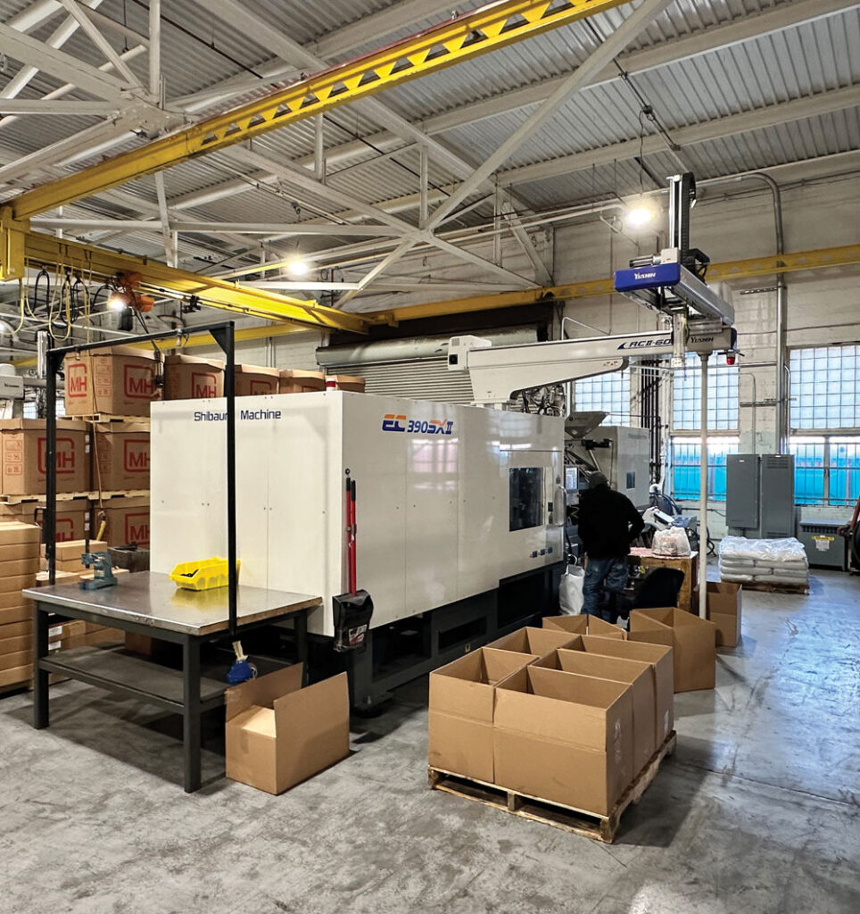 An injection molding machine at the Cooper Plastics manufacturing facility